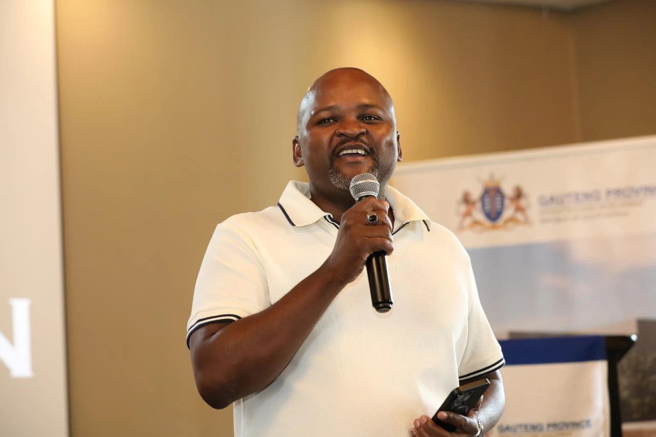 Tshepo Matseba speaking with a microphone